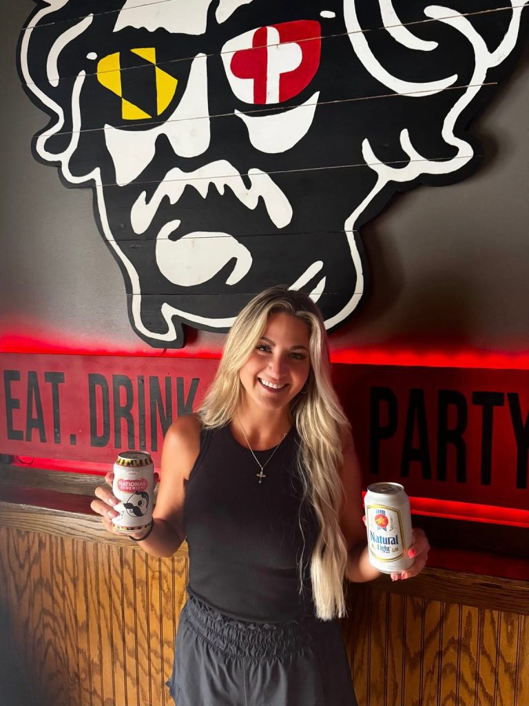 Natty Boh and Natural Light cans under the Twain's Tavern mural